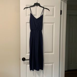 Navy midi dress with side slit. Adjustable cross cross straps.
